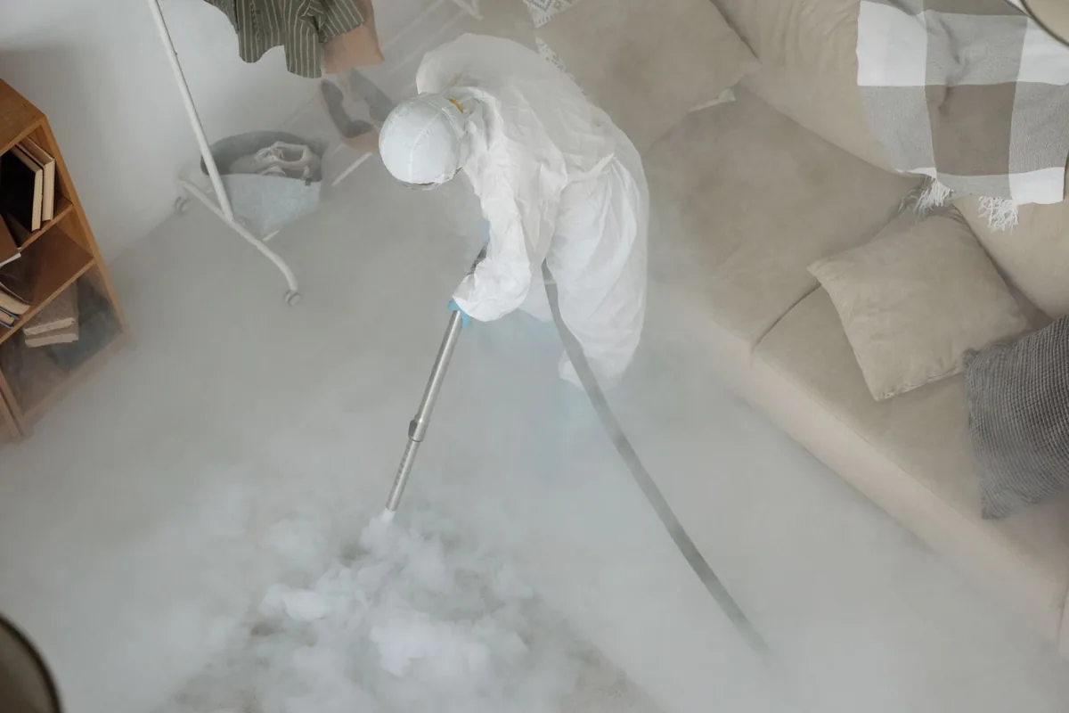 Biohazard cleanup technician in protective equipment, Pantops, VA